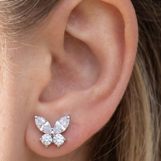 Butterfly Ear Piercings – selection on linen